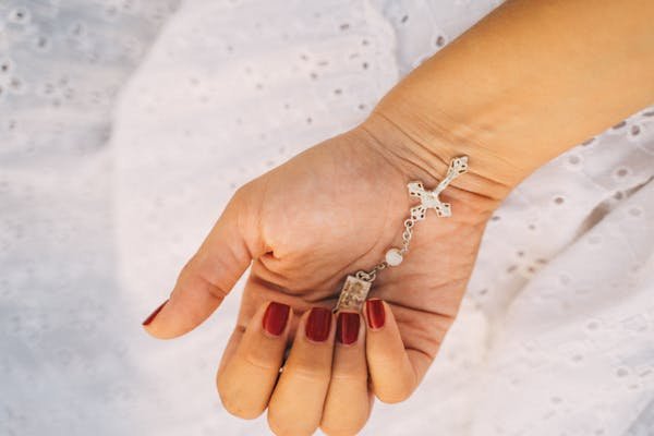 Elevate your style with the red cross bracelet today!